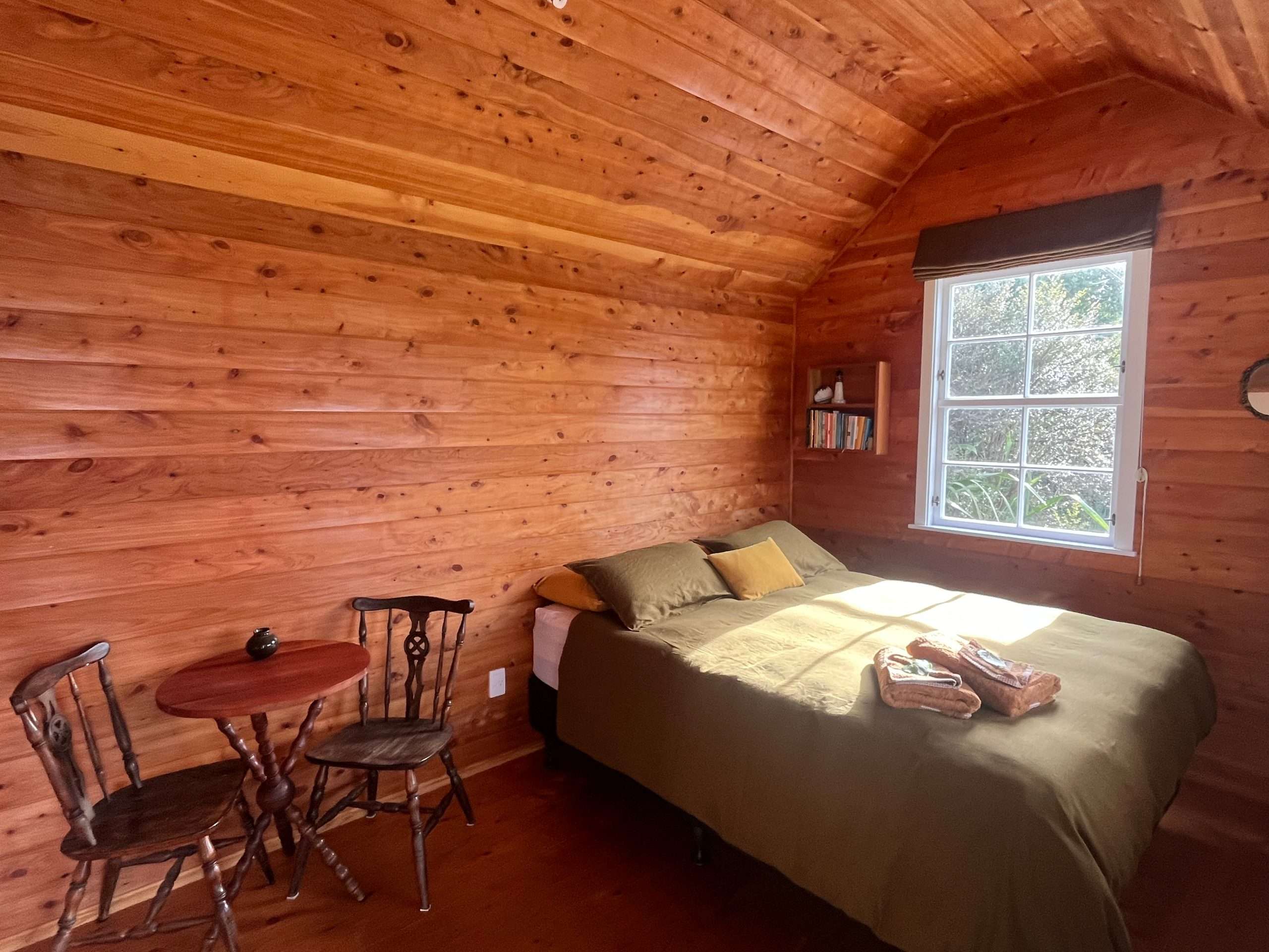 The queen bed inside Arkaya Cabin