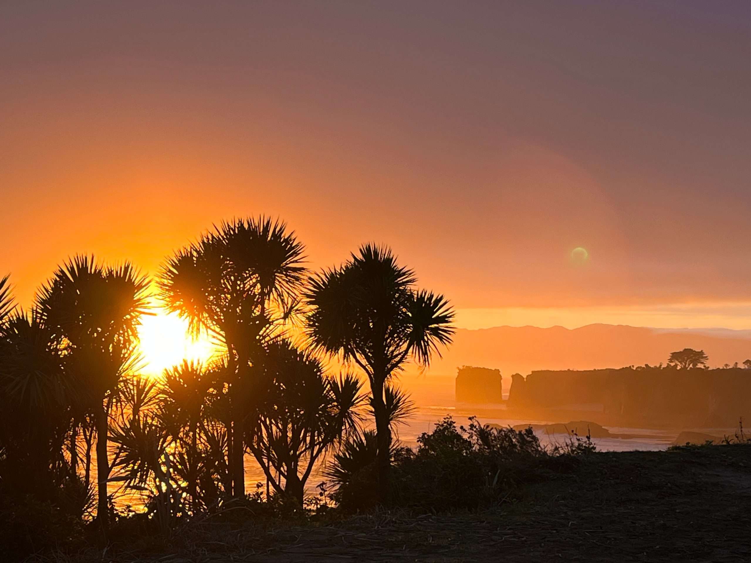 Sunrise over the Tasman Sea from the Cape Foulwind clifftop